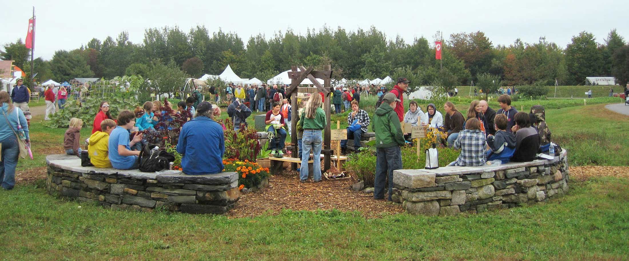 Standing loom at fair ground with people around